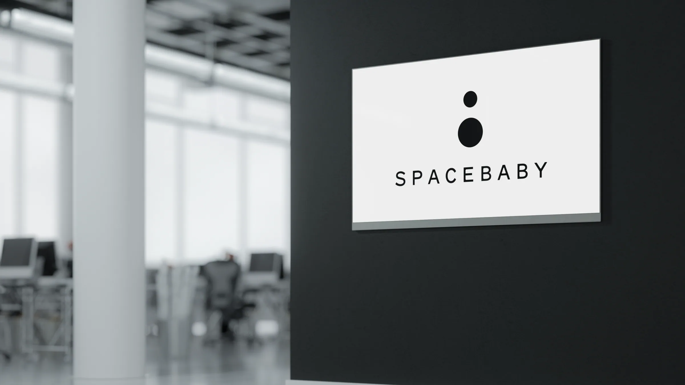 Spacebaby branding on an office display